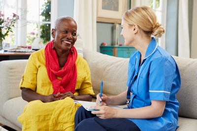 caregiver and senior woman talking