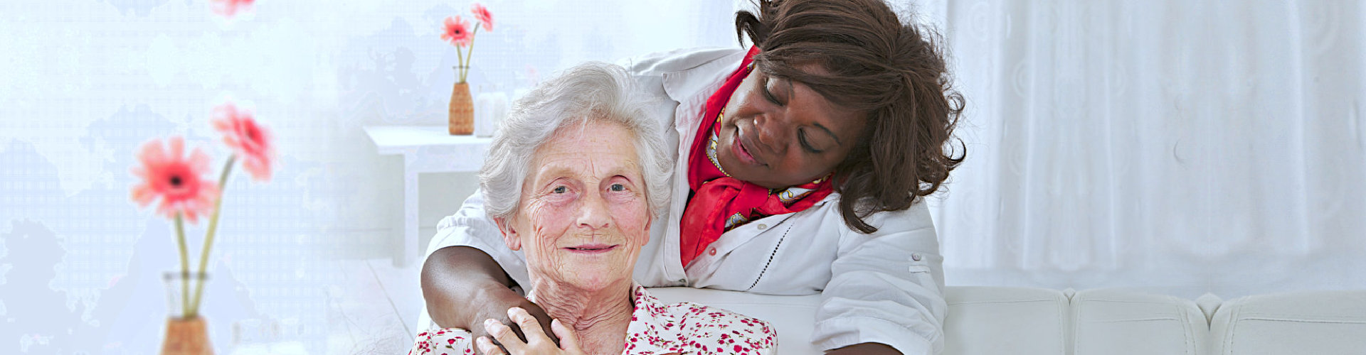 caregiver looking at senior woman