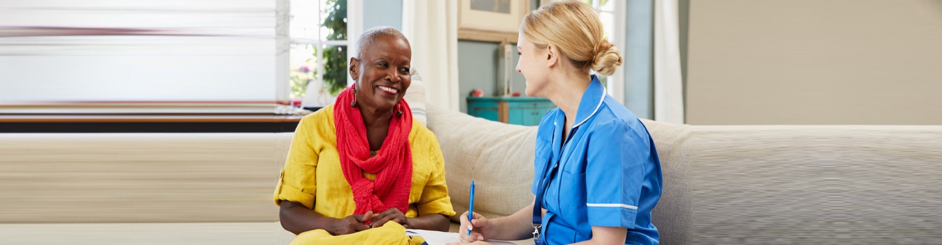 caregiver and senior woman talking